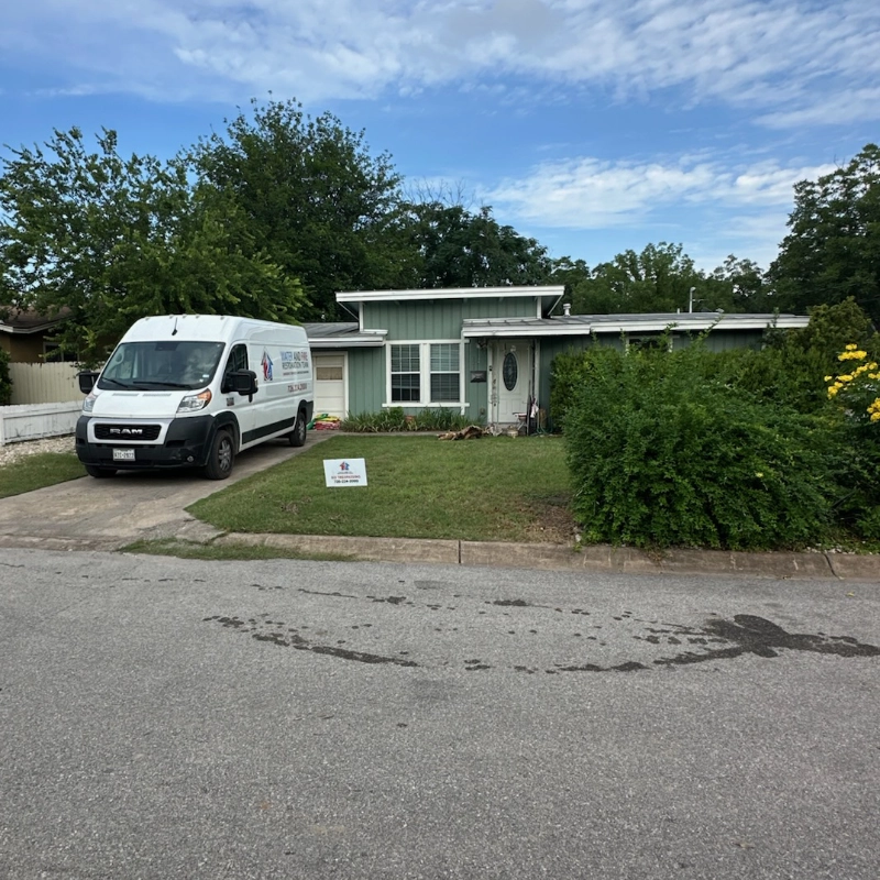 WAFRT van in front of a client's house