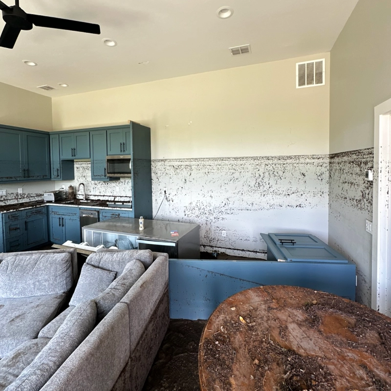 Interior water damage in a home kitchen after flooding